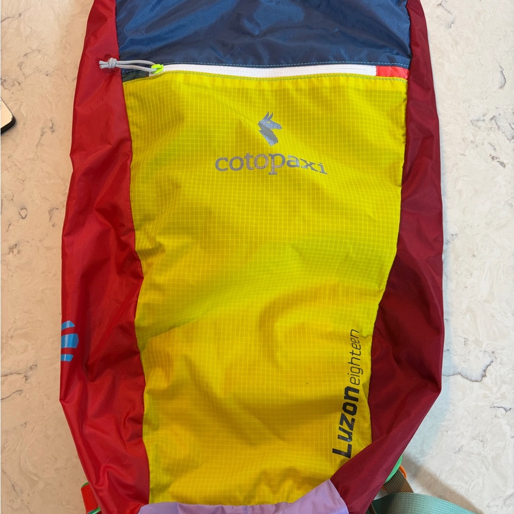 Cotopaxi Luzon Eighteen Backpack in Red, Yellow, and Blue